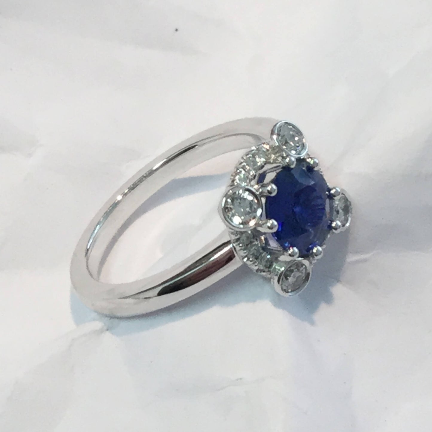 Sapphire Entourage Ring with Larger Diamonds in Closed Setting