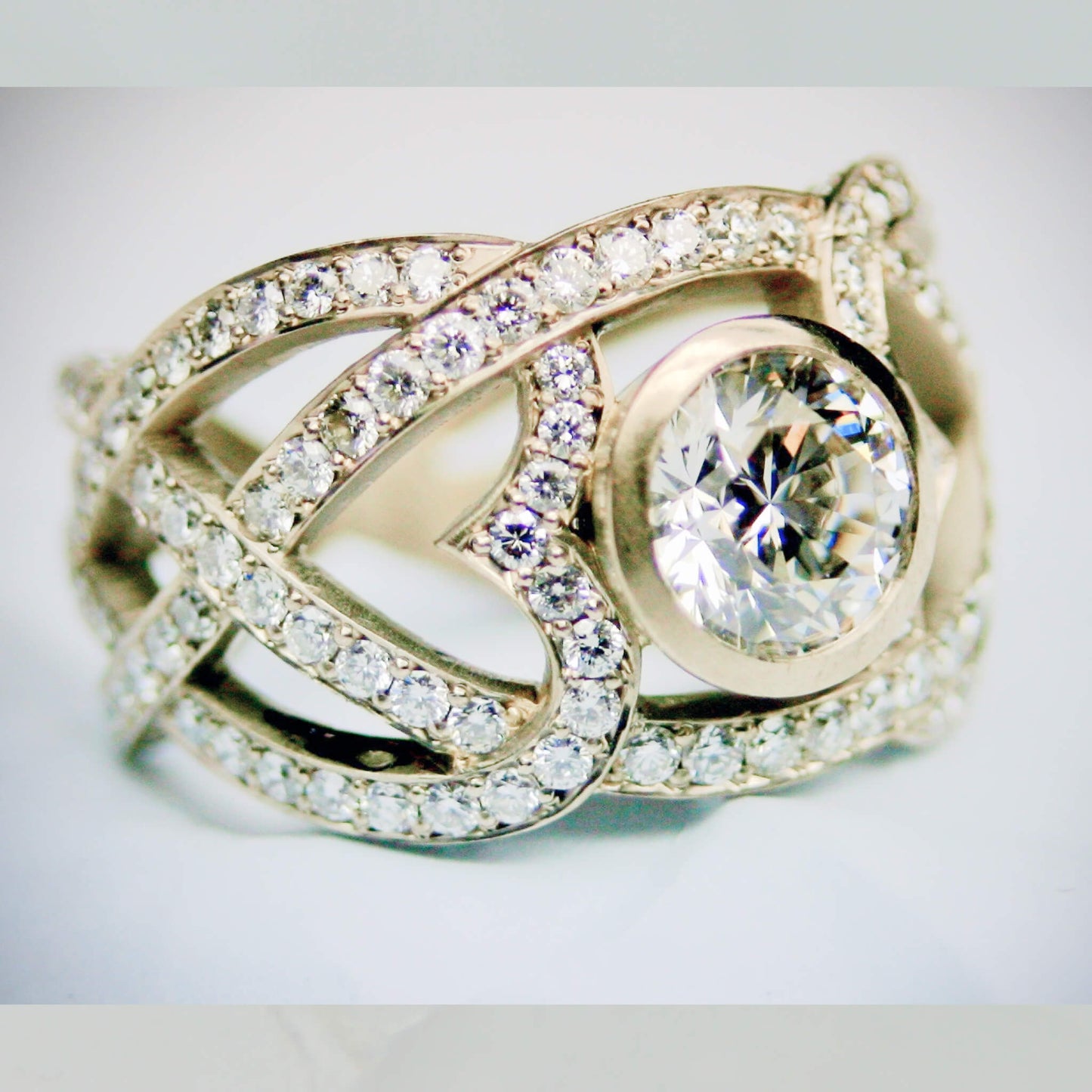 Diamond Pavé Ring with Bezel-Set Center