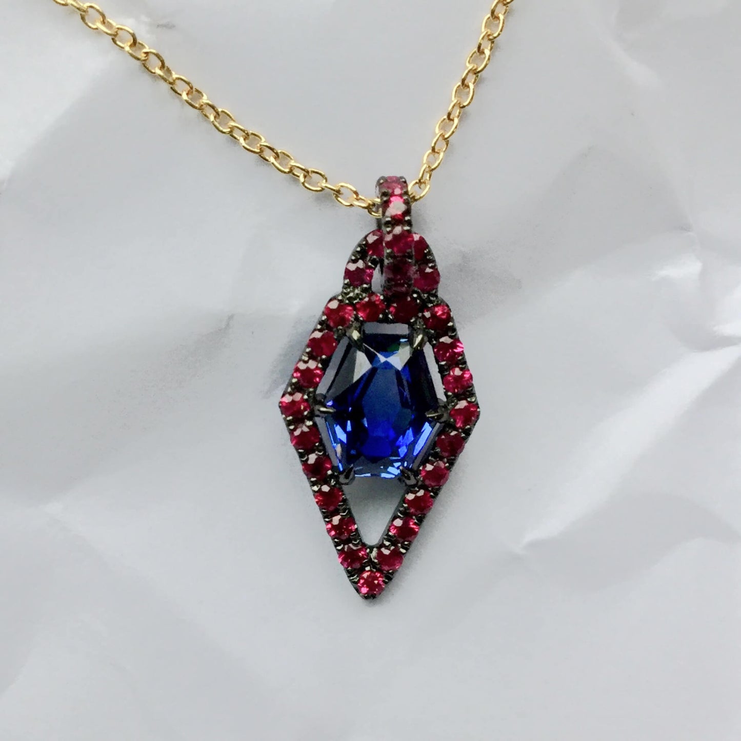 Blue Sapphire Pendant with Ruby Pavé