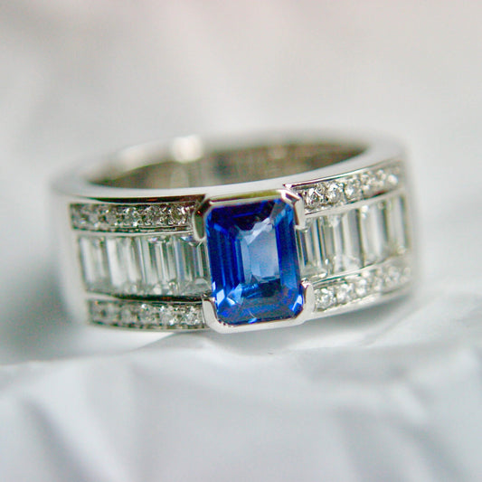 Emerald-Cut Sapphire Ring with Baguette Diamonds in White Metal Rail Setting