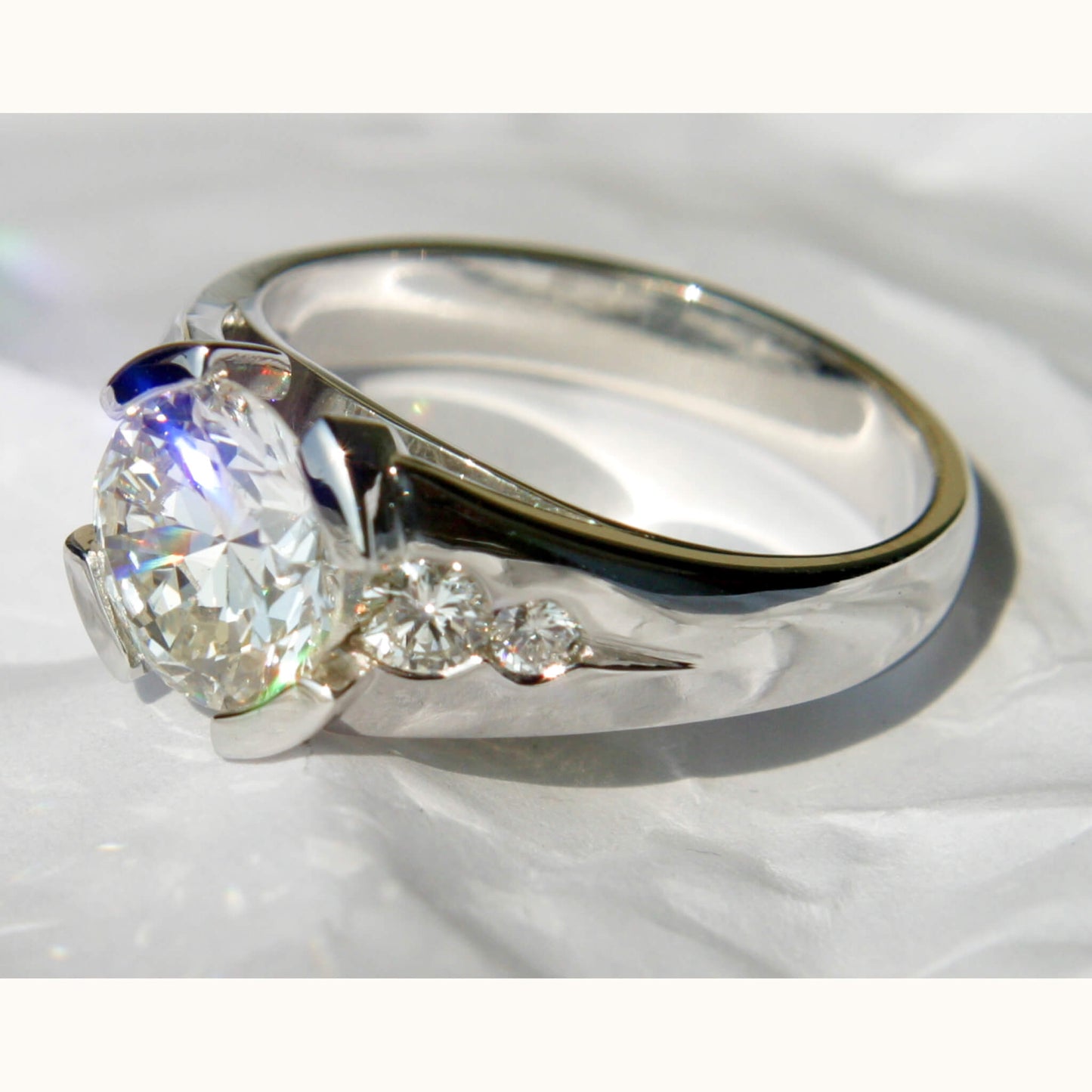 White Gold Solitaire Ring with Half-Open Setting and Fillet-Set Side Brilliants